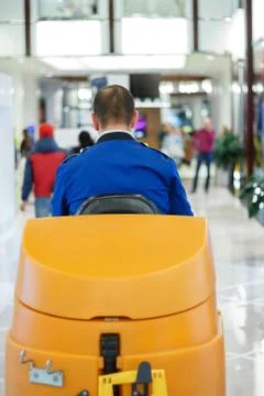 Cleaner at the sweeper in the mall Stock Photos