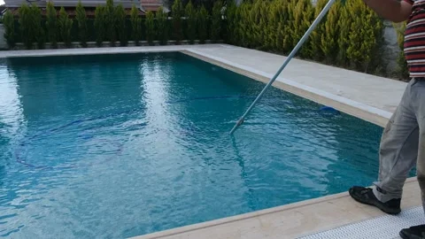 The cleaner who cleans the pool. The cleaner who cleans the pool floor. Stock Footage 145865446