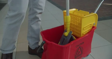 Cleaner work at the mall. Wash floor with the mop. Stock-Footage 138096120