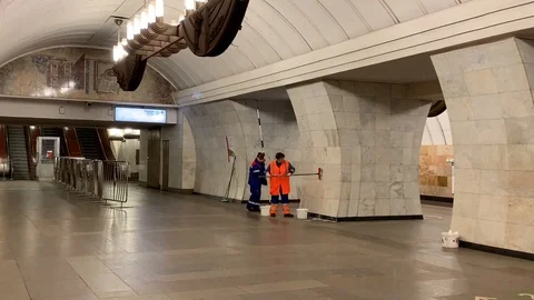 Cleaners wash the walls and ceiling in the subway Stock Footage 103580053