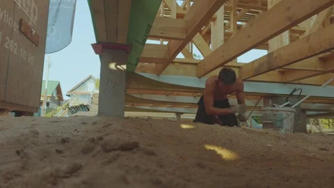 Cleaning after construction, cleaning up debris under the house Stock Footage 340359811
