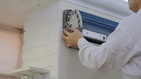 Cleaning agent is applied with a brush to the ducts of the home air conditioner Stock Footage 122085205
