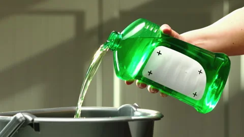 Cleaning agent from green buttle added to a bucket GT0672 Stock Footage 130881882