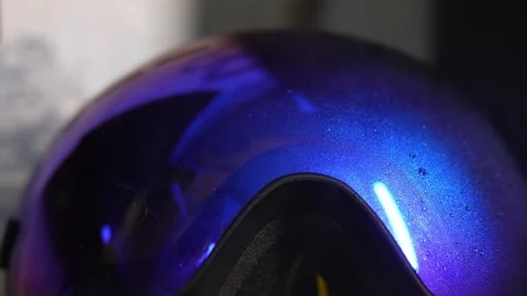 The cleaning agent is sprayed onto the surface of the snowboard mask Stock Footage 321588077