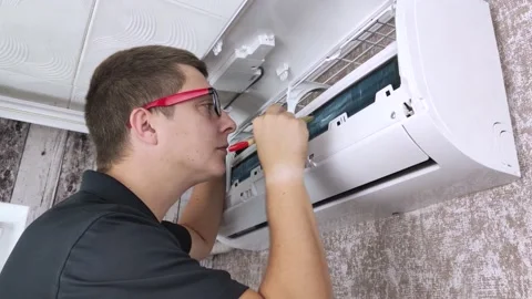 Cleaning the air conditioner from dust, mold and dirt. An air conditioner mainte Stock Footage 137623836