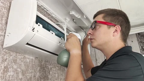 Cleaning the air conditioner from dust, mold and dirt. An air conditioner mainte Stock Footage 137623970