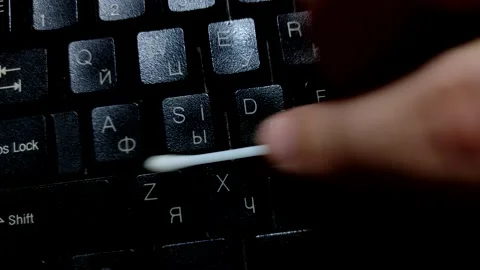 Cleaning and caring for a computer keyboard with Russian-English layout. Stock Footage 141340082