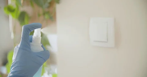 Cleaning and disinfecting  light switch at home covid 19 pandemic crisis Vídeo Stock 127796264