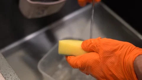 Cleaning and Maintenance: A Step-by-Step Sequence of Dishwashing and Sink Stock Footage 321051068