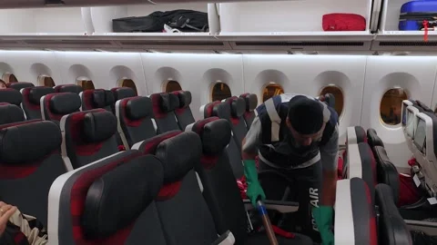 Cleaning and organizing cabin space on a commercial flight Vídeo Stock 310071792