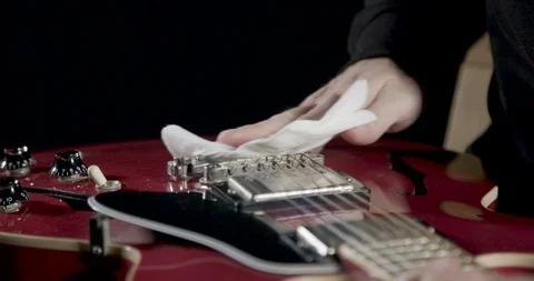 Cleaning and polishing a high gloss electric guitar 動画素材 101602853