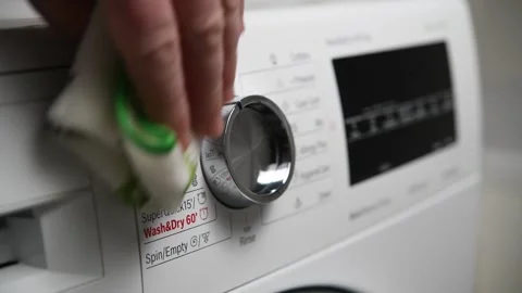 Cleaning and wiping the washing machine panel. Stock Footage 299566565