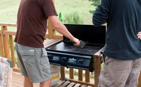 Cleaning the barbecue Stock Photos