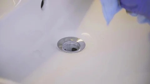 Cleaning bathroom sink Stock Footage
