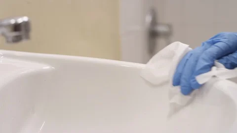 Cleaning a bathroom sink Stock Footage 127225252