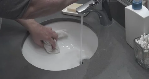 Cleaning the Bathroom Sink Stock Footage 158192174