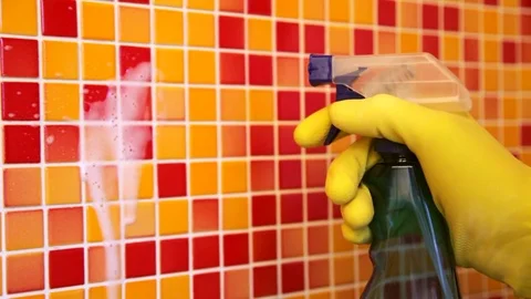 Cleaning bathroom wall with sprayer Stock Footage 75473150