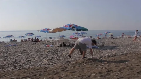 Cleaning up a beach Stock Footage 91092244