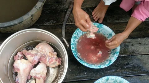Cleaning beef bones for cooking soup Stock Footage 310997078