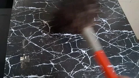 Cleaning a black marble floor with a mop. Professional cleaning in progress for Stock Footage 340480649