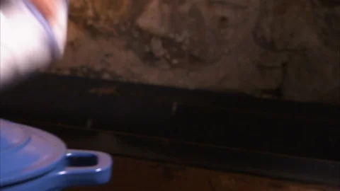 Cleaning a blue casserole Stock Footage 86254470
