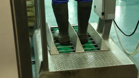 Cleaning boots before entering area Stock Footage 39832805