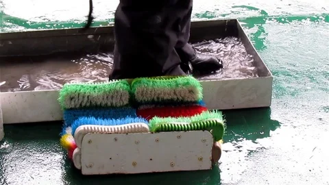 Cleaning Boots on Ship Stock Footage 125769823