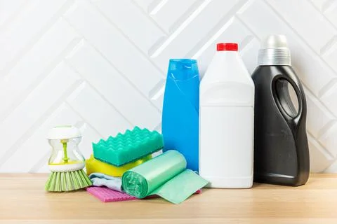 Cleaning bottles for different surfaces in kitchen, bathroom and other rooms. Stock Photos
