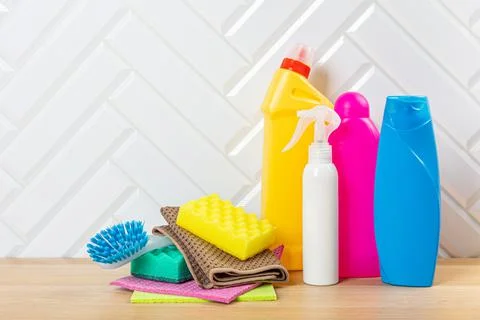 Cleaning bottles for different surfaces in kitchen, bathroom and other rooms. Stock Photos