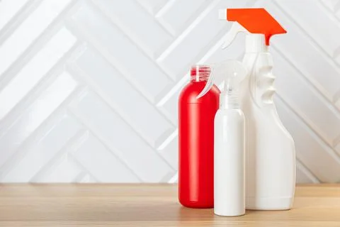 Cleaning bottles for different surfaces in kitchen, bathroom and other rooms. Stock Photos