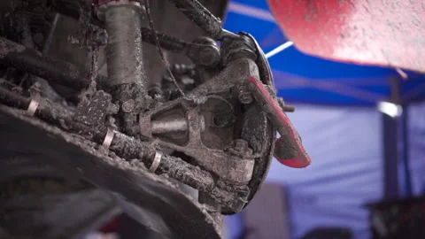 Cleaning the brakes of the machine with a jet of compressed air. Footage. A Video stock 167021227