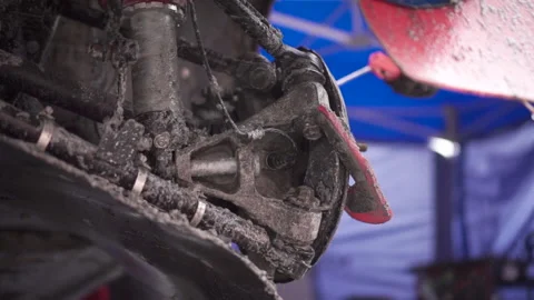 Cleaning the brakes of the machine with a jet of compressed air. Footage. A Stockbeeldmateriaal 167075586
