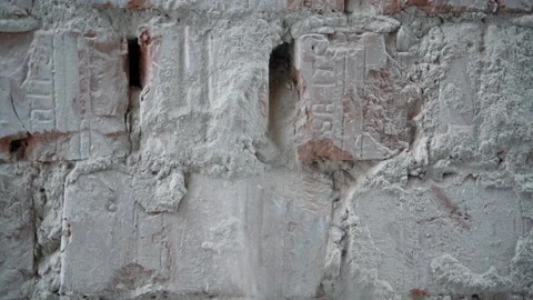 Cleaning bricks from plaster with hand Stock Footage 161164707