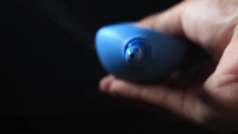 Cleaning camera lens from the dust with a rubber blower Stock Footage 146394113