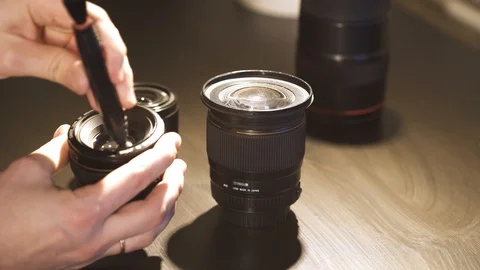Cleaning the camera lens Stock Footage 126536413