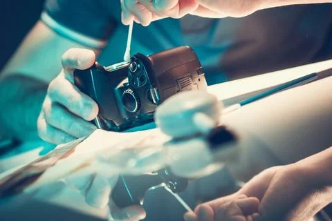 Cleaning a Camera Sensor With a Cotton Swab in a Well-Lit Workspace During .. Stock Photos