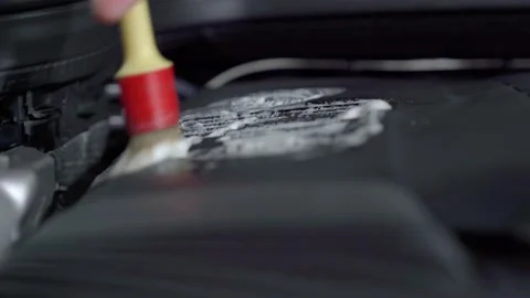Cleaning the car engine with the help of sprays and brushes Video stock 148228505