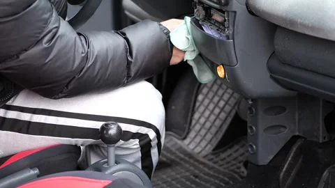 Cleaning car interior dashboard with a cloth. Stock Footage 326070585