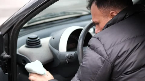 Cleaning car interior dashboard with a cloth. Stock Footage 326070606