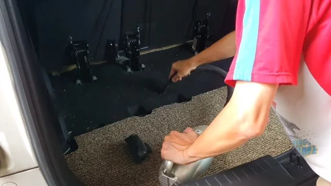 Cleaning car interior with a vacuum cleaner, removing dust and dirt from se.. Stock Footage 301062782
