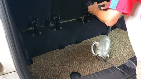 Cleaning car interior with a vacuum cleaner, removing dust and dirt from se.. Stock Footage 301062794