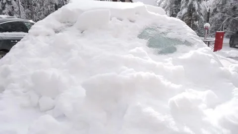Cleaning a Car from Snow with A Plastic Scraper Stock Footage 292450687