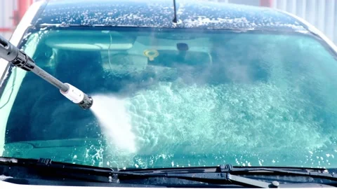 Cleaning the car, using a high-pressure washer, in the open air. Stock Footage 154355145