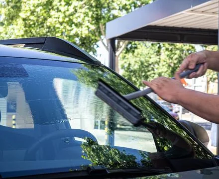 Cleaning the Car Windshield Stock Photos