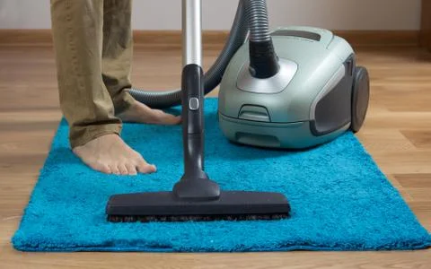 Cleaning carpet with cleaner Stock Photos
