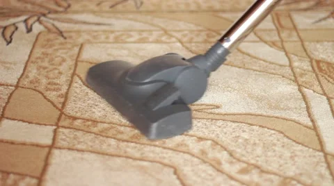 Cleaning a carpet with a vacuum cleaner Stock Footage 62020839