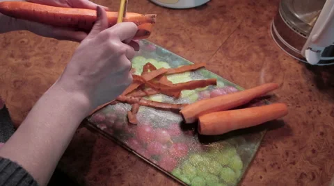 Cleaning carrot, knife Stock Footage 61492293