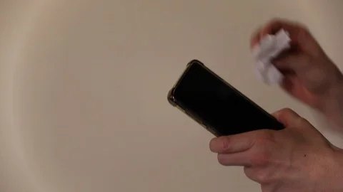 Cleaning a Cell Phone Stock Footage 129964754