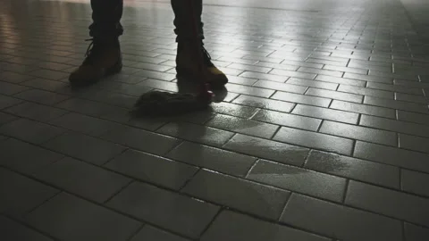 Cleaning ceramic paved floor with mop Stock-Footage 147560168