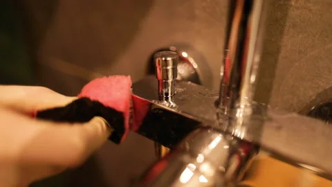 Cleaning chrome faucets in the bathroom. Stock Footage 237839271